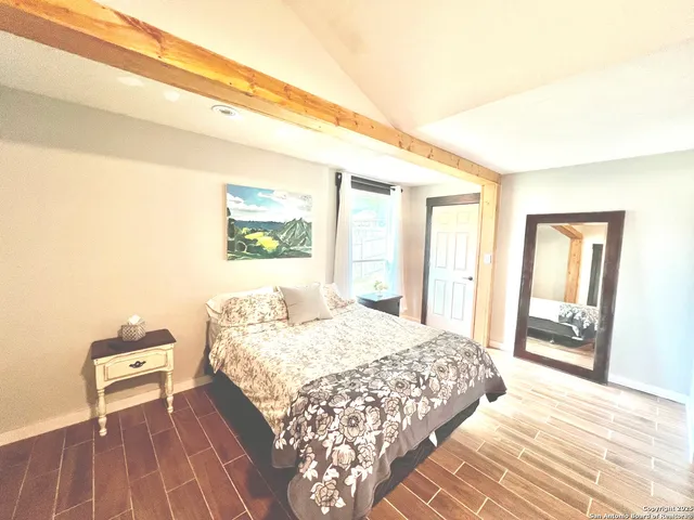 a bedroom with a bed and a dresser