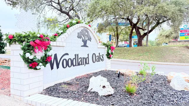 a view of a table and chair and potted on the side of the road