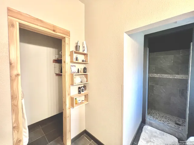 a view of a bathroom from a hallway