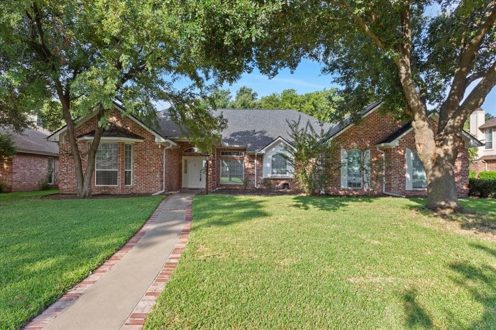 9412 Silverthorn Drive Waco, TX 76708 - Photo 1 of 16 a front view of a house with a yard