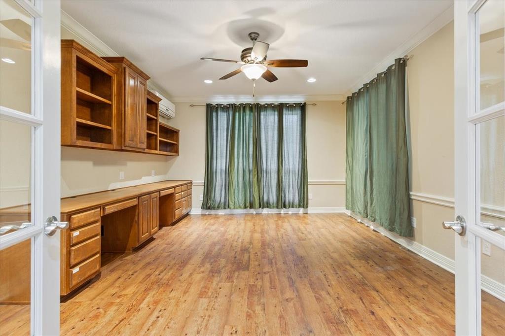 9412 Silverthorn Drive Waco, TX 76708 - Photo 5 of 16 a open kitchen with stainless steel appliances granite countertop a stove top oven a sink and dishwasher with wooden floor