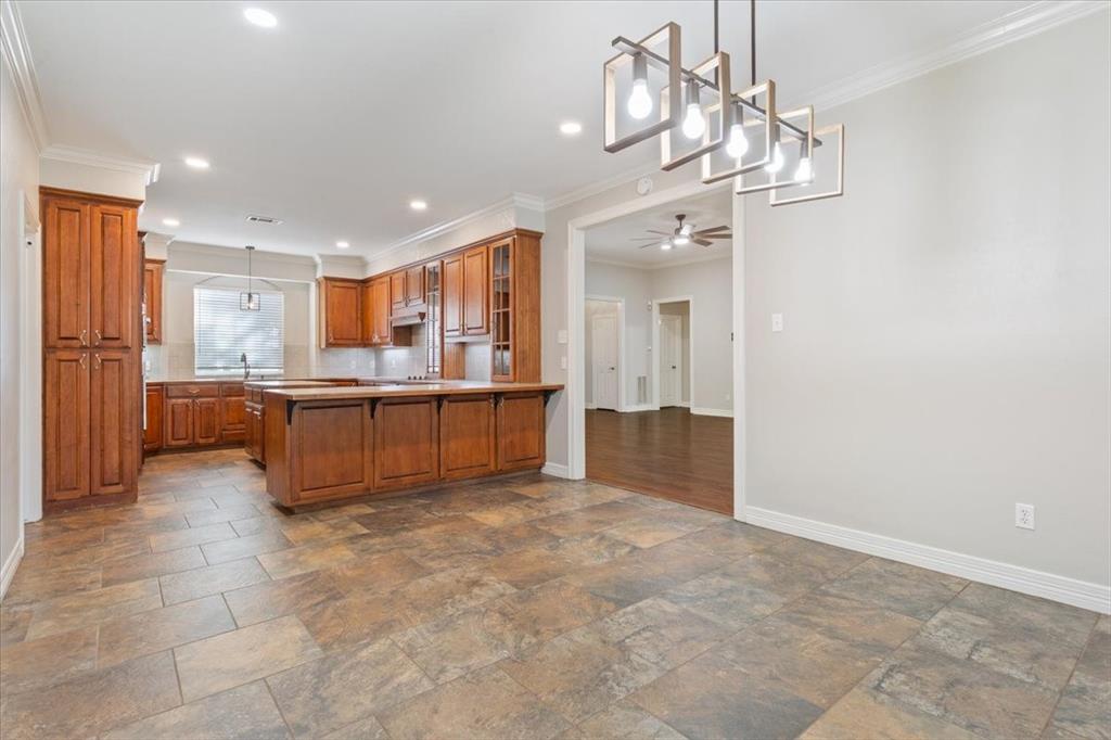 9412 Silverthorn Drive Waco, TX 76708 - Photo 7 of 16 a view of a kitchen with a sink and cabinets