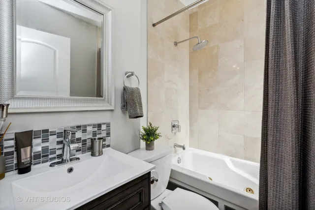 a bathroom with a sink a toilet and a bathtub