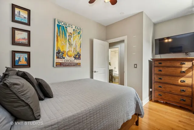 a bedroom with a bed and a television