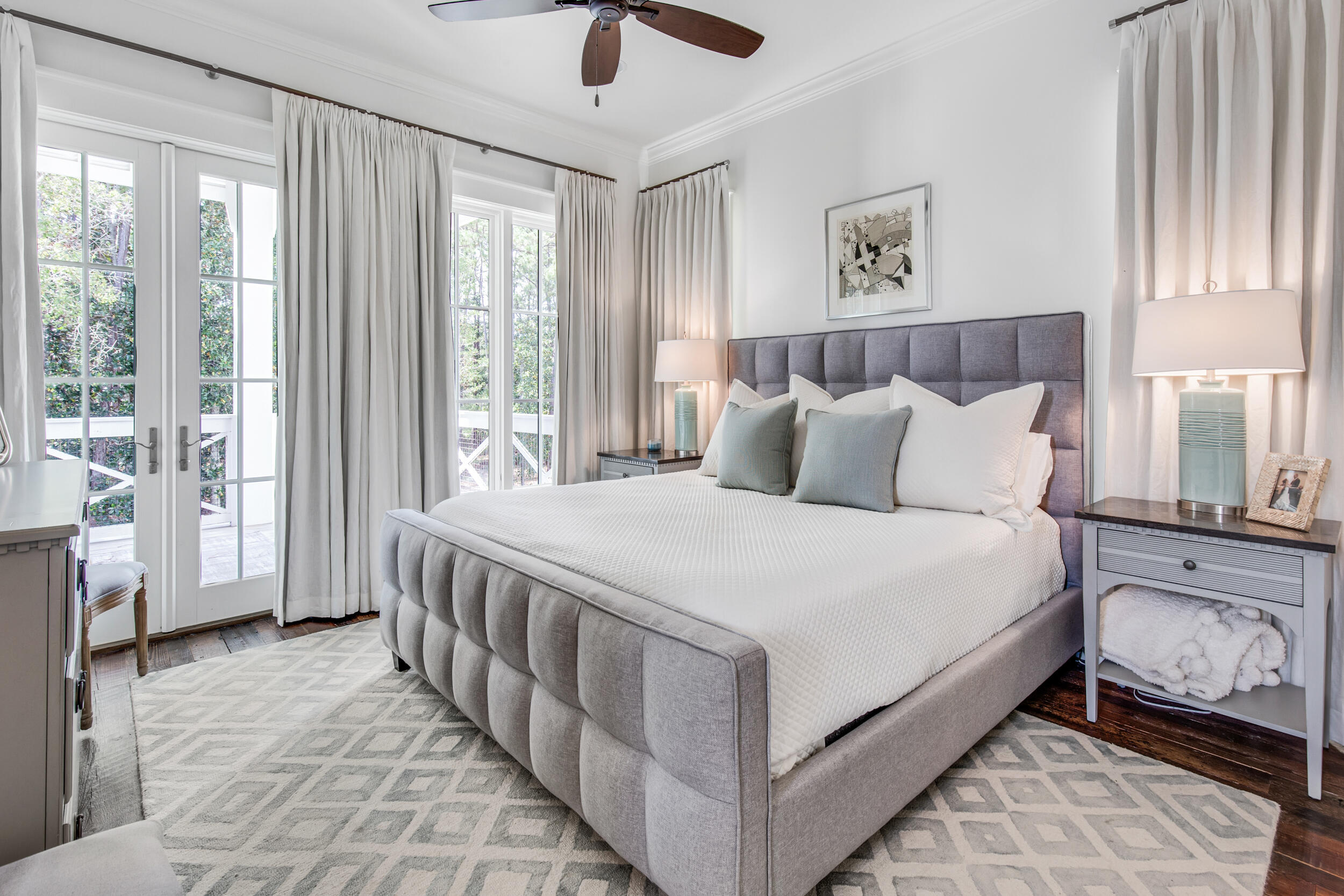 29 Bennett Santa Rosa Beach, FL 32459 - Photo 32 of 60 a bedroom with a large bed and a chandelier fan