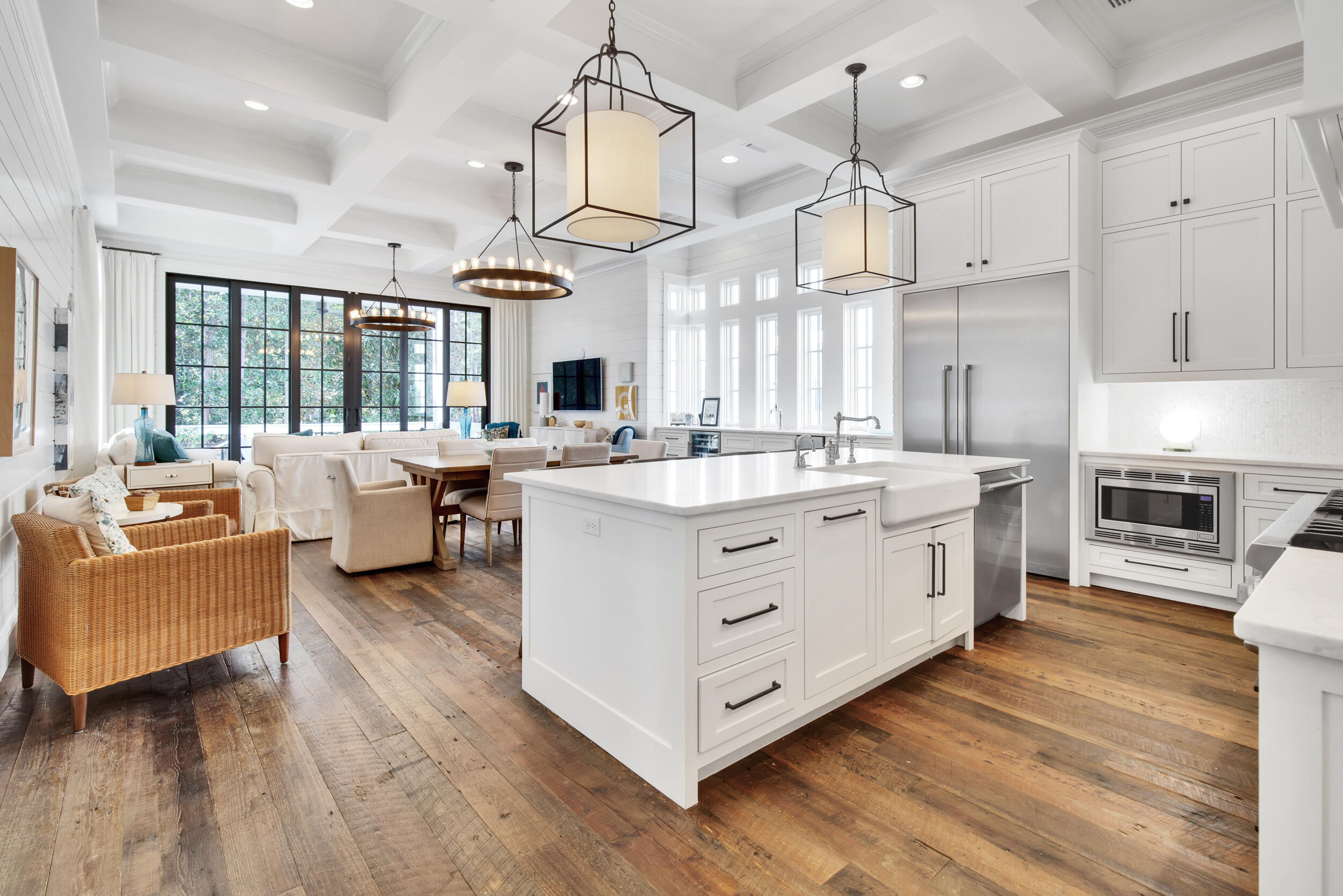 29 Bennett Santa Rosa Beach, FL 32459 - Photo 6 of 60 a kitchen with stainless steel appliances kitchen island wooden floors and white cabinets