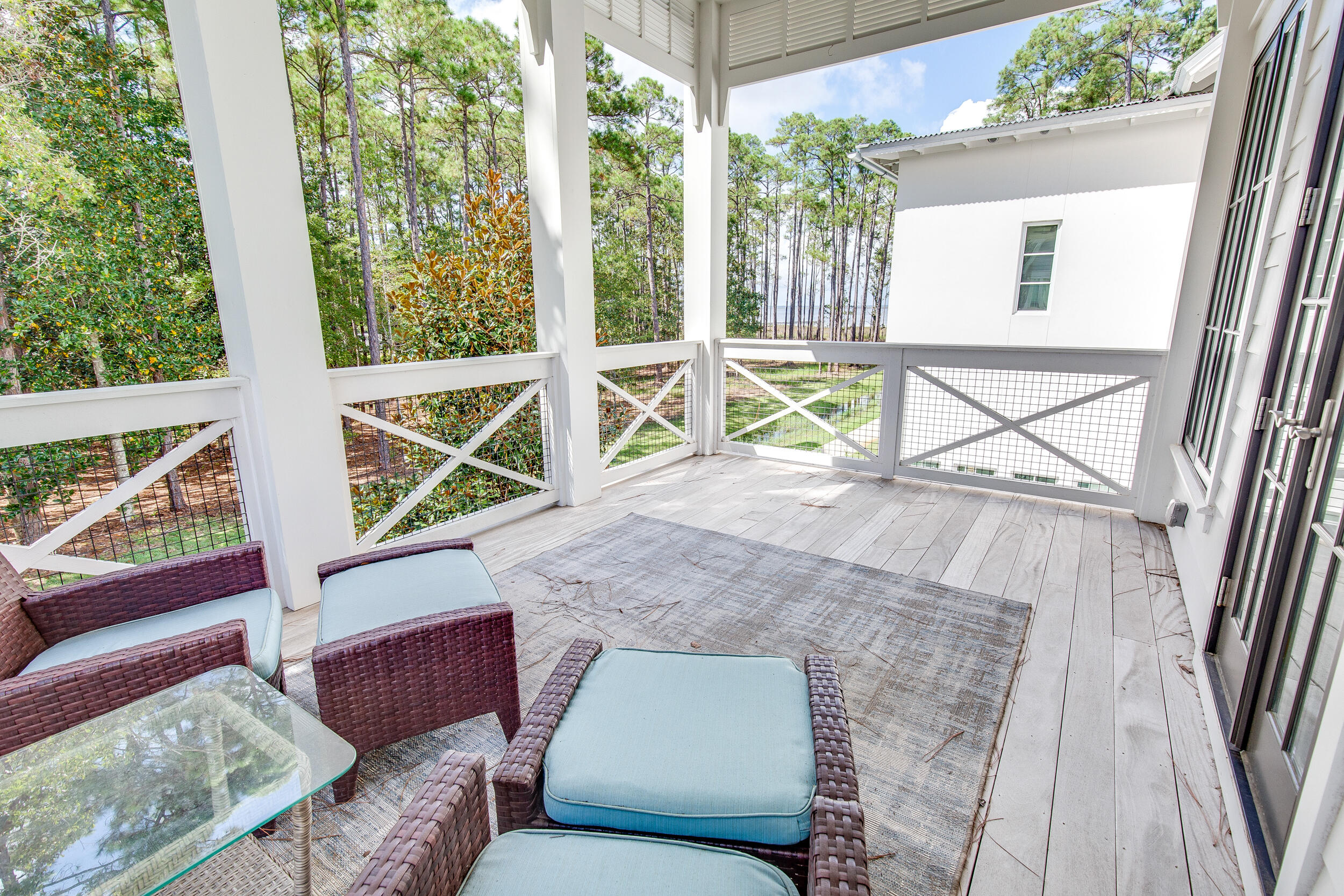 29 Bennett Santa Rosa Beach, FL 32459 - Photo 54 of 60 a living room with furniture and a floor to ceiling window