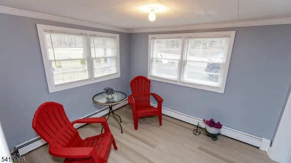 a living room with blue furniture and a window