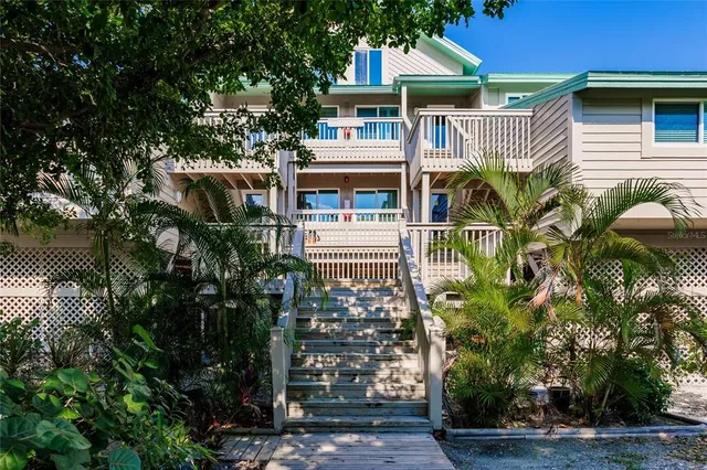 a front view of a house with a small yard