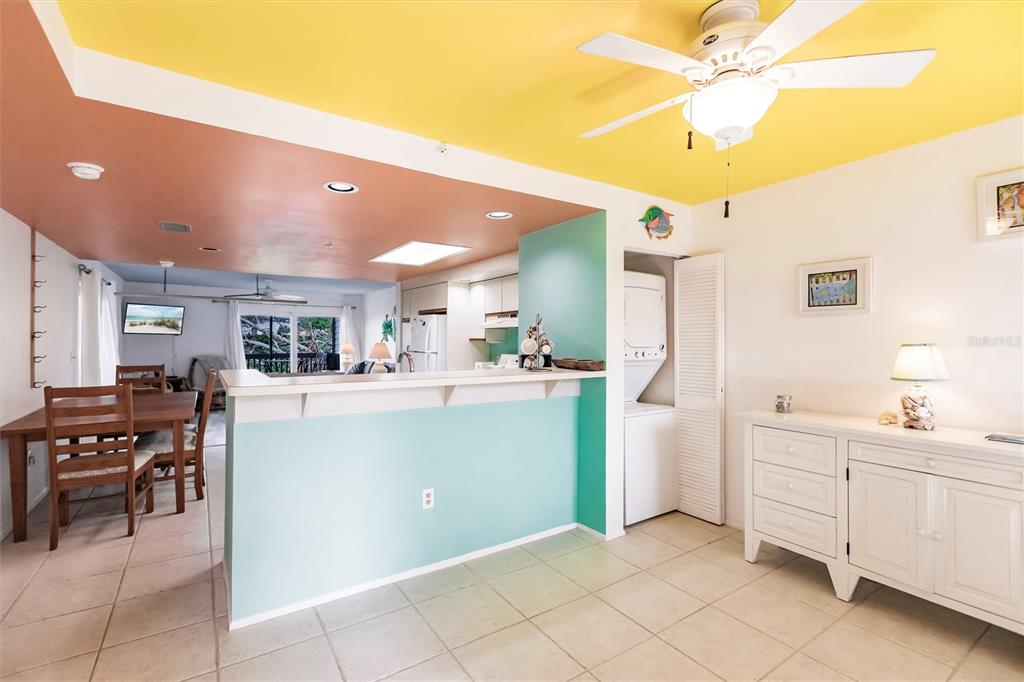 9200 Little Gasparilla, Unit 203 Placida, FL 33946 - Photo 12 of 41 a kitchen with a refrigerator and a sink