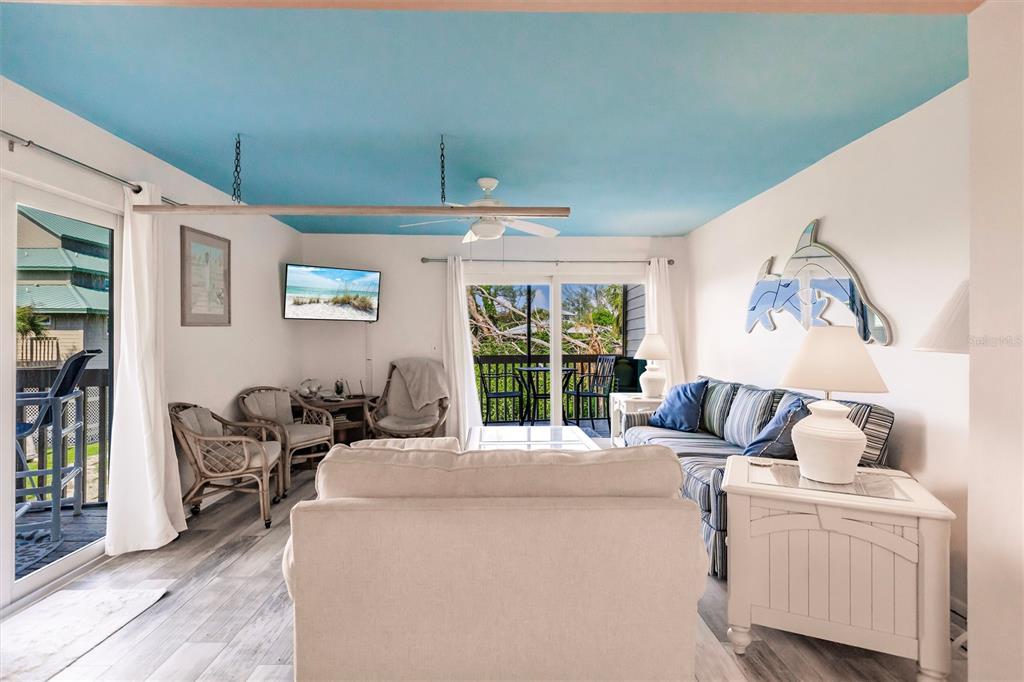 9200 Little Gasparilla, Unit 203 Placida, FL 33946 - Photo 19 of 41 a bed room with a bed and a chair