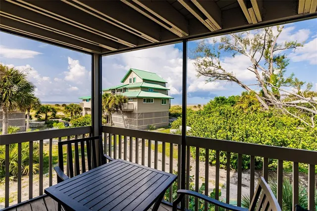 a view of a balcony with wooden floor