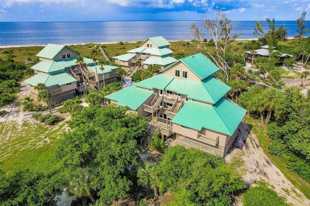 9200 Little Gasparilla, Unit 203 Placida, FL 33946 - Photo 34 of 41 an aerial view of a house with a garden