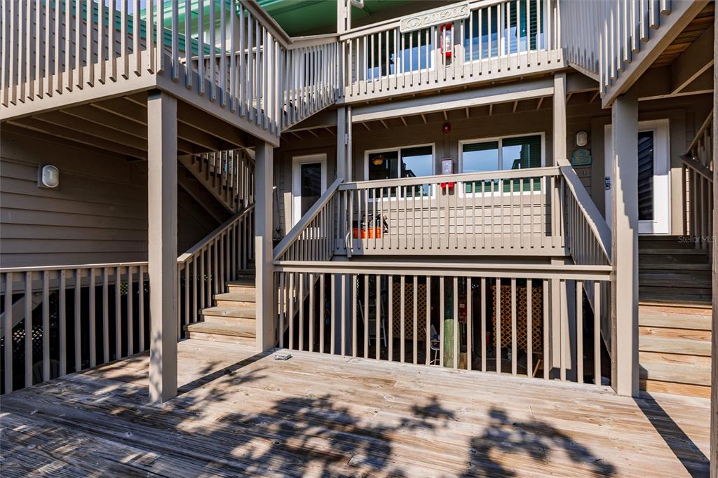 9200 Little Gasparilla, Unit 203 Placida, FL 33946 - Photo 4 of 41 a view of a wooden house with large windows