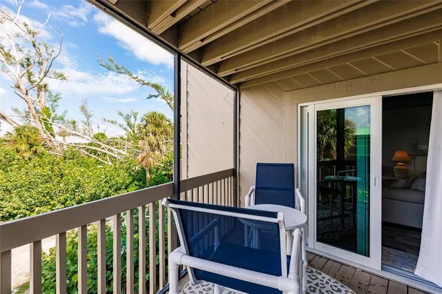 a view of balcony with wooden floor