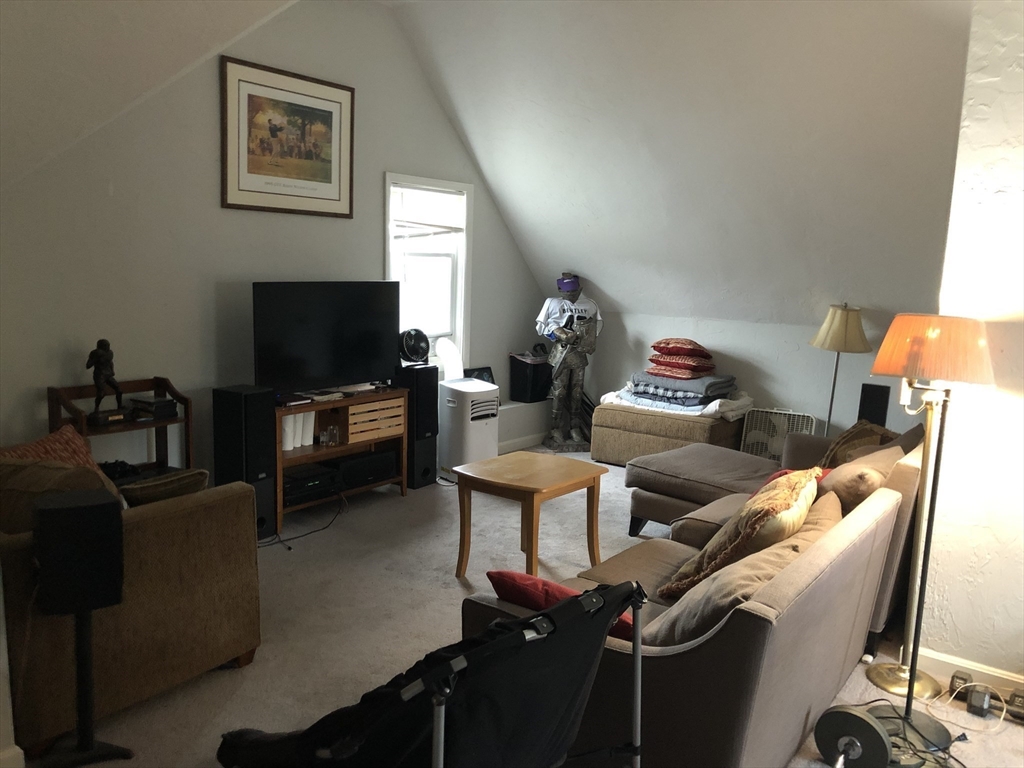1122 Adams Street, Unit 2 Boston, MA 02124 - Photo 16 of 21 a living room with furniture and a flat screen tv