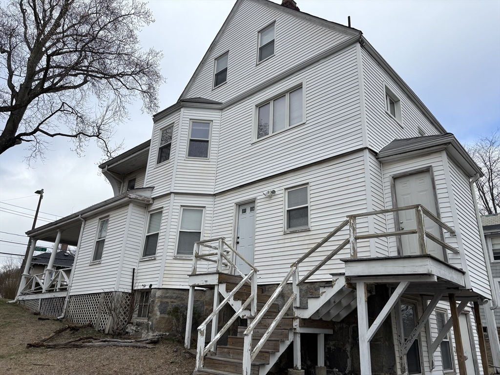 1122 Adams Street, Unit 2 Boston, MA 02124 - Photo 18 of 21 a view of a white house with a large windows