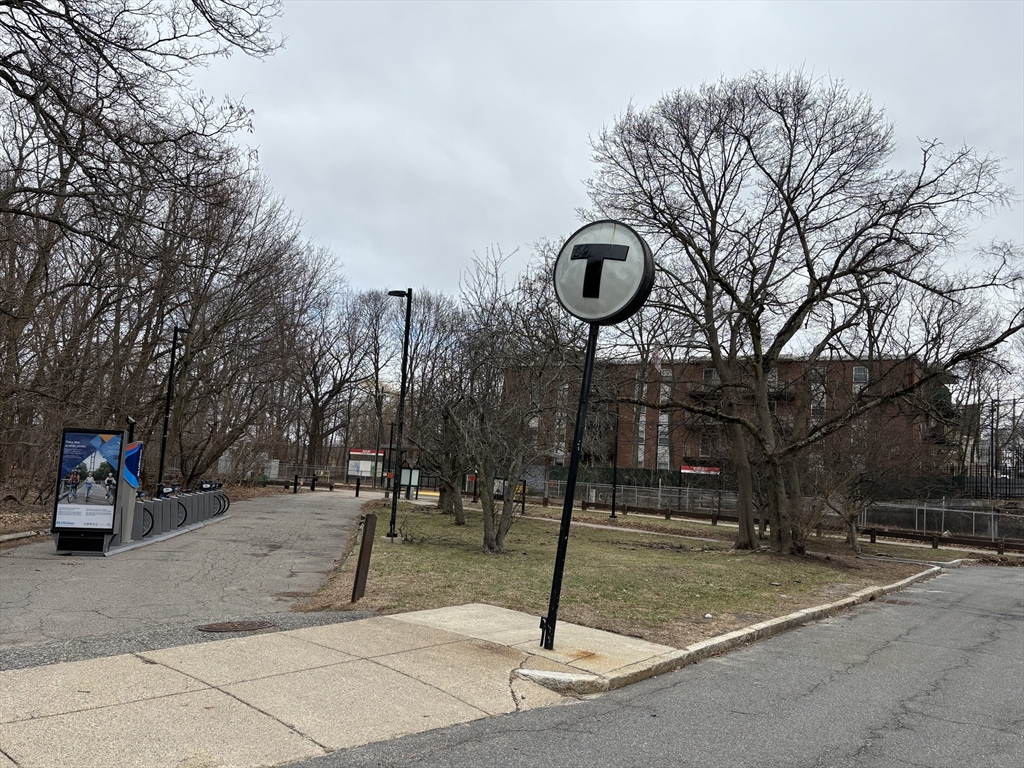 1122 Adams Street, Unit 2 Boston, MA 02124 - Photo 20 of 21 a front view of a building with trees
