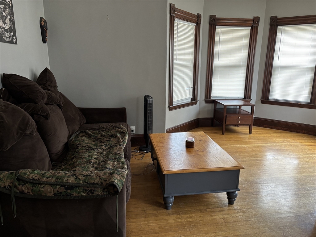 1122 Adams Street, Unit 2 Boston, MA 02124 - Photo 8 of 21 a living room with furniture and a window