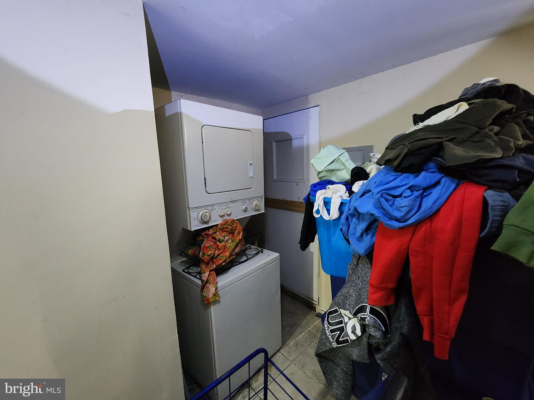 2710 Woodview Road Baltimore, MD 21225 - Photo 14 of 17 a view of walk in closet with clothes and shoes