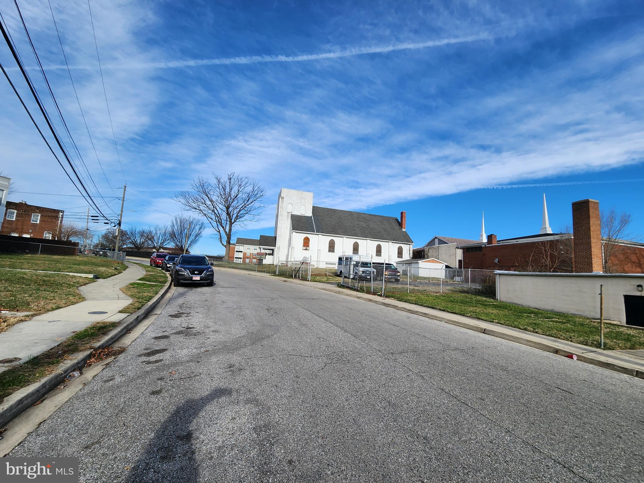 2710 Woodview Road Baltimore, MD 21225 - Photo 16 of 17 a view of a street with cars parked