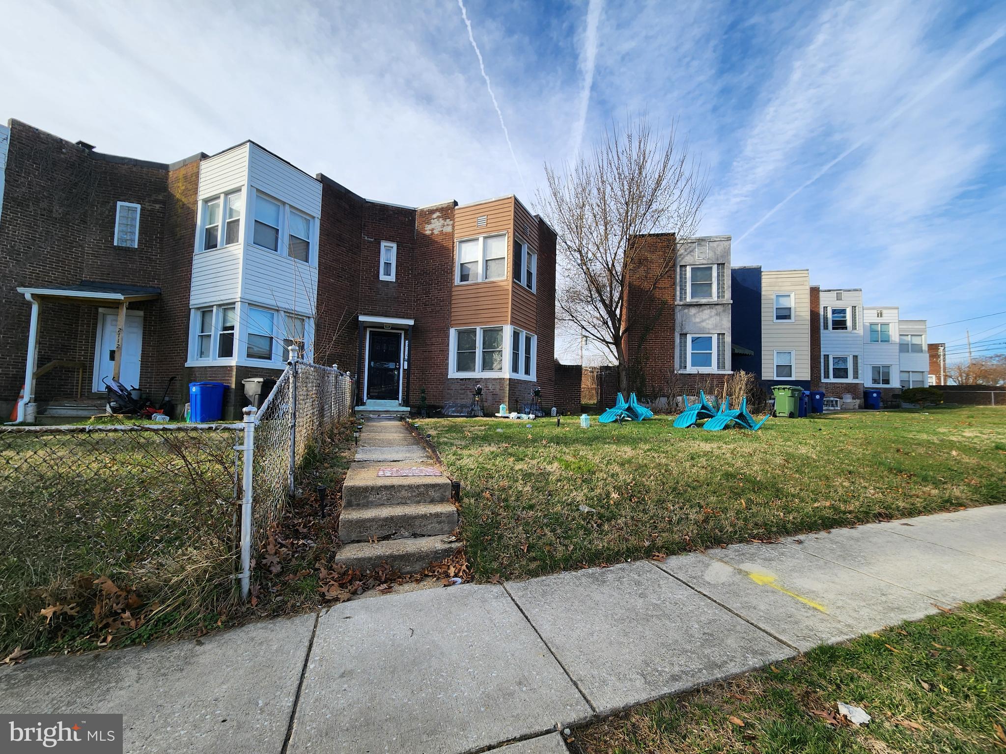 2710 Woodview Road Baltimore, MD 21225 - Photo 2 of 17 a front view of a building with garden