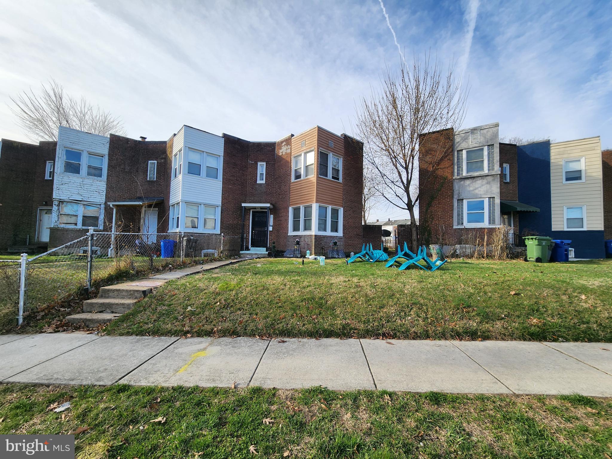 2710 Woodview Road Baltimore, MD 21225 - Photo 3 of 17 a brick building with a yard in front of it