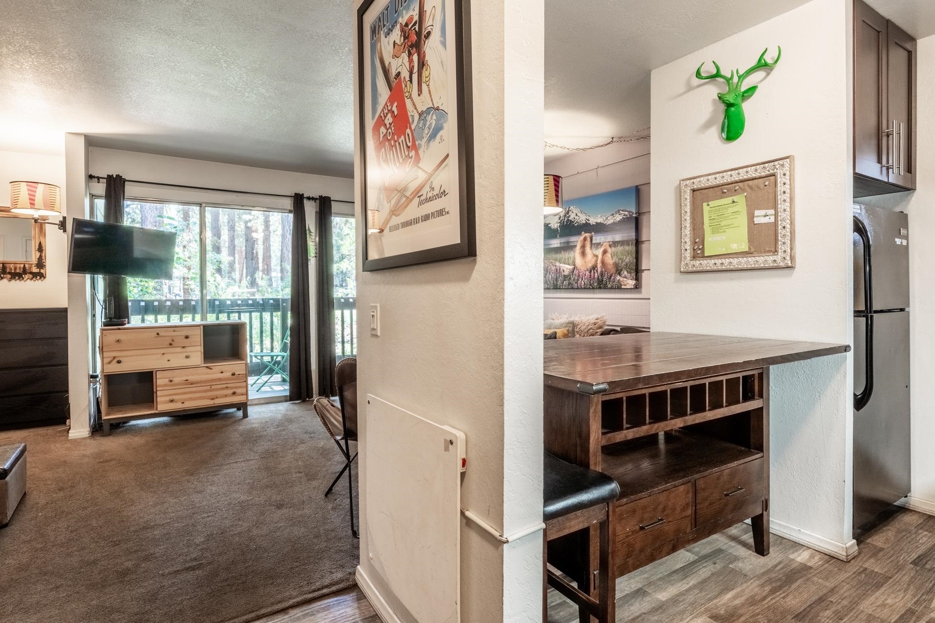 2289 Sierra Nevada Road, Unit G8 Mammoth Lakes, CA 93546 - Photo 12 of 23 Hall featuring wood finished floors and a textured ceiling