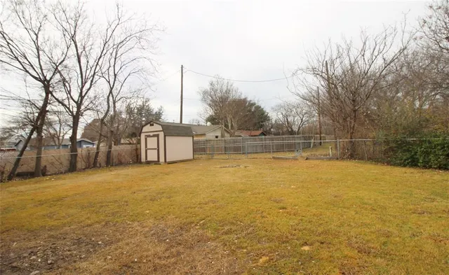 a view of a lake with houses in the background