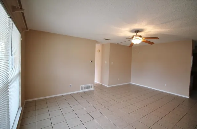 an empty room with fan