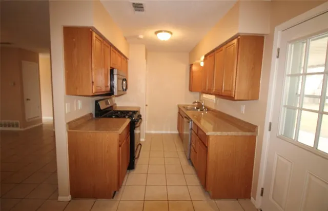 a utility room with sink a washer and dryer