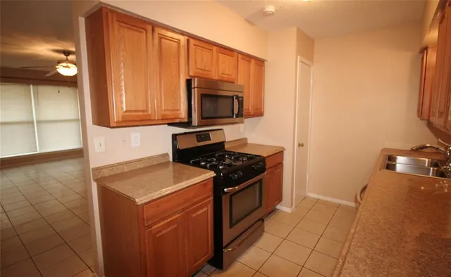a kitchen with a stove and a microwave