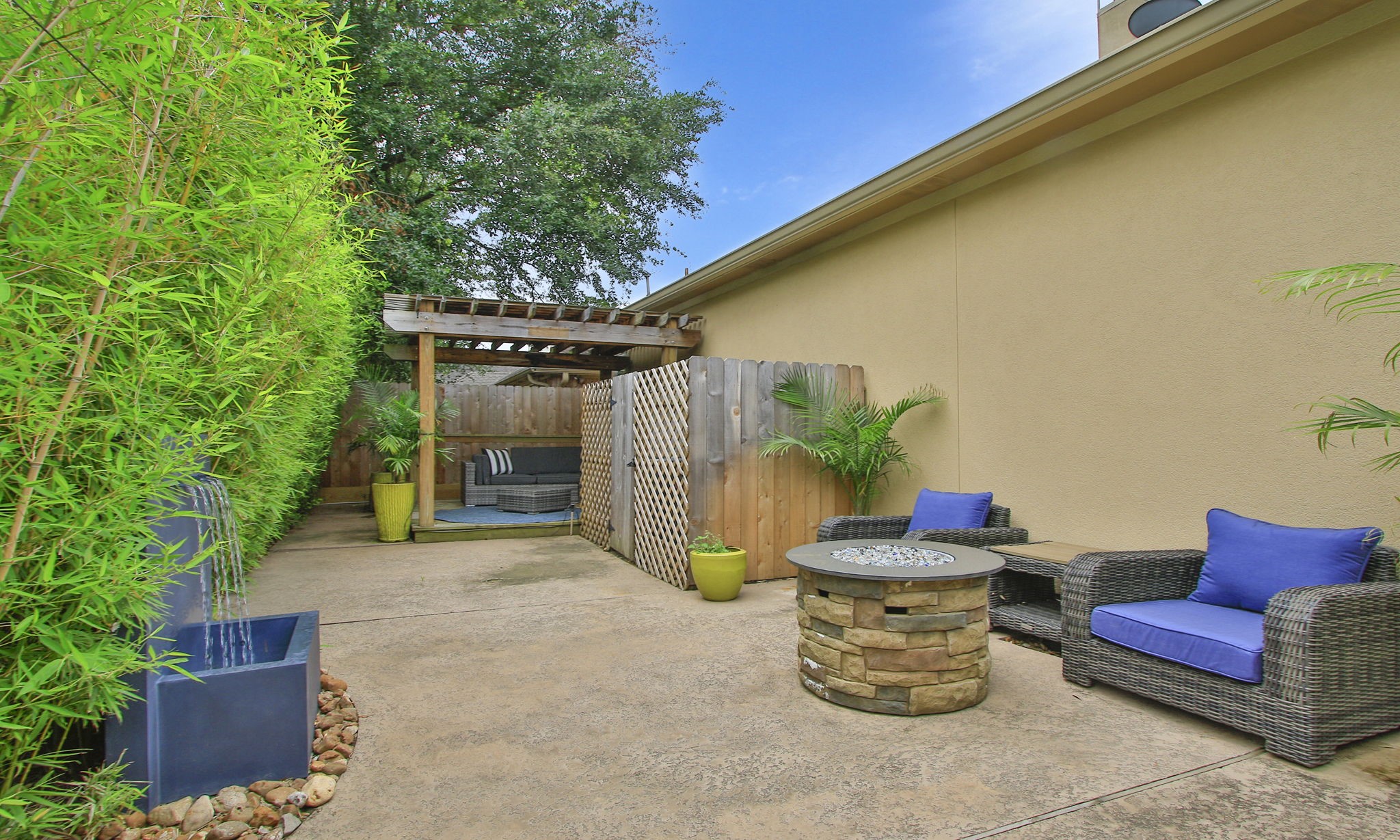 16610 Manningtree Lane Spring, TX 77379 - Photo 47 of 50 The back patio is quite large for a patio home and this owner has added the pergola, firepit and waterfall to finish off all the living spaces of the home.