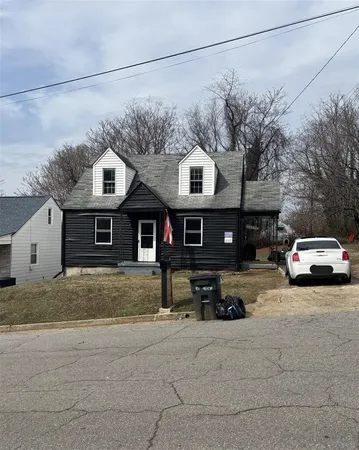 a view of a car parked in front of house