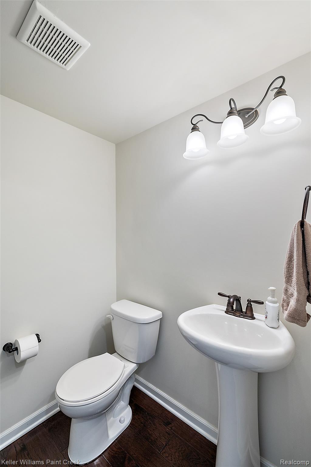 314 Glenhurst Boulevard Rochester, MI 48307 - Photo 20 of 64 Half bath with baseboards and dark wood-style flooring