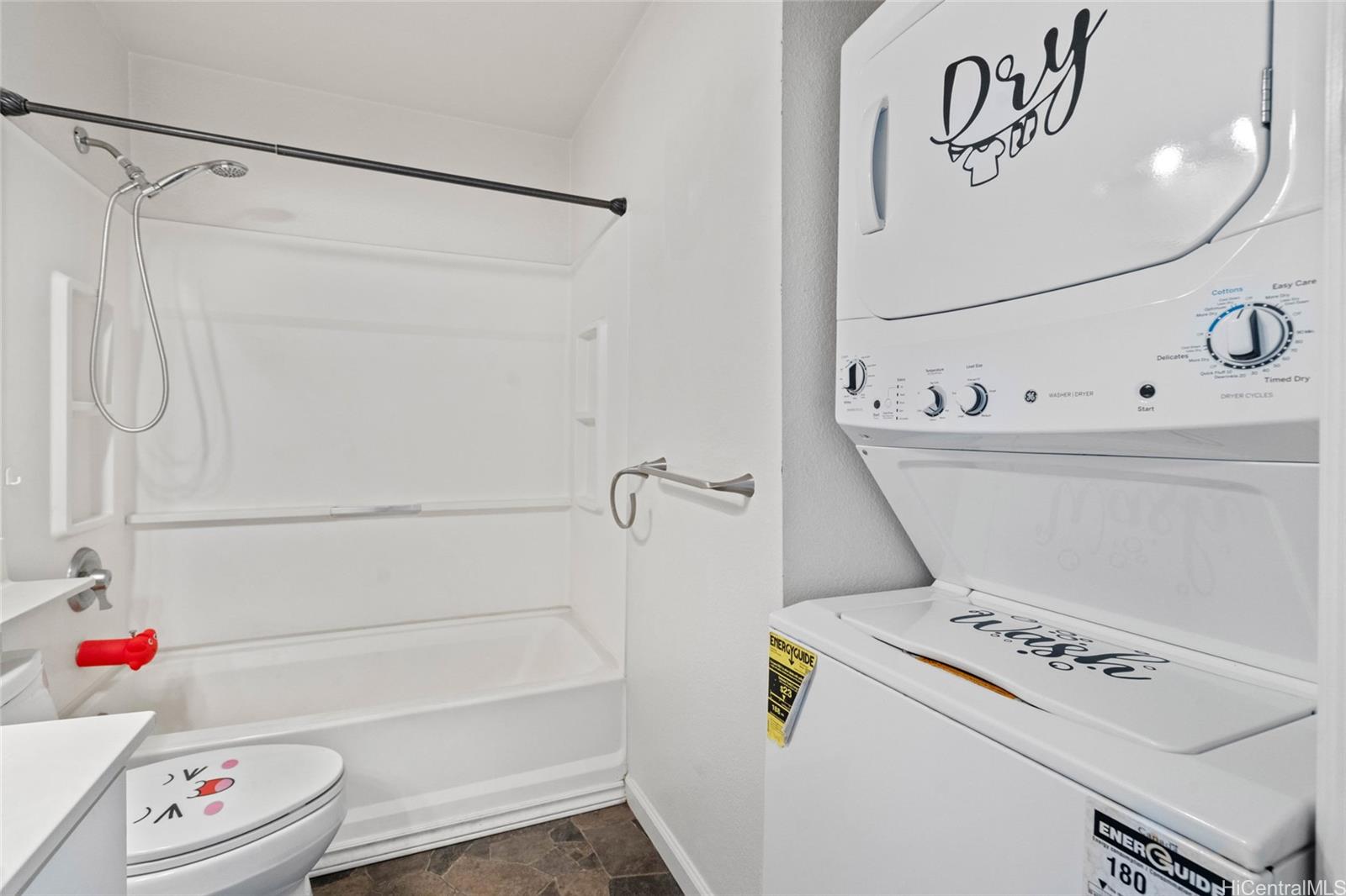 91-299 Hanapouli Circle, Unit 1C Ewa Beach, HI 96706 - Photo 13 of 25 a bathroom with a bathtub and a shower