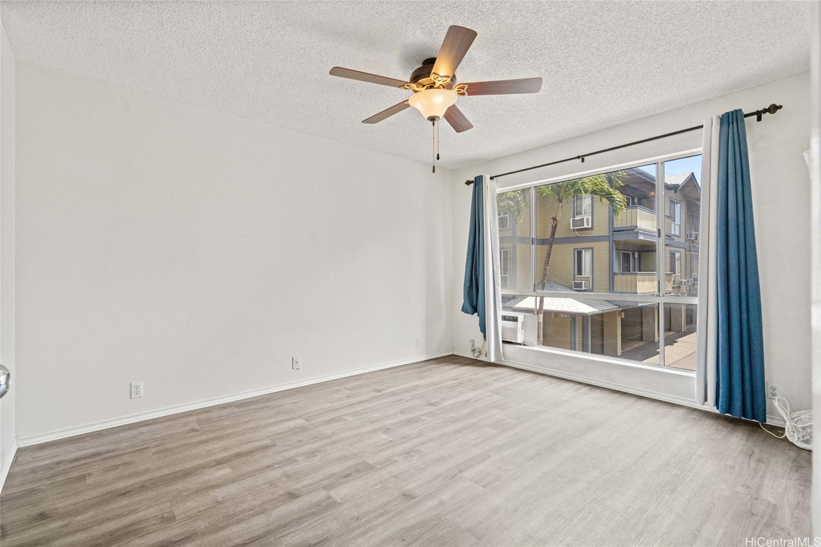 91-299 Hanapouli Circle, Unit 1C Ewa Beach, HI 96706 - Photo 17 of 25 a view of an empty room with a window