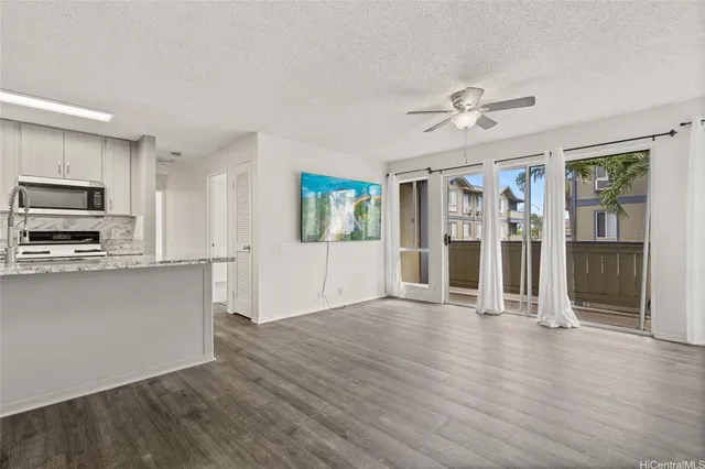 a view of a kitchen with a microwave and a stove