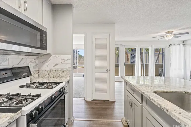 a kitchen with a stove and a sink