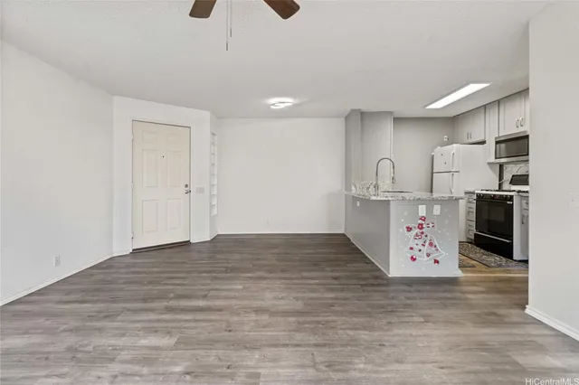 a view of kitchen center island and stainless steel appliances