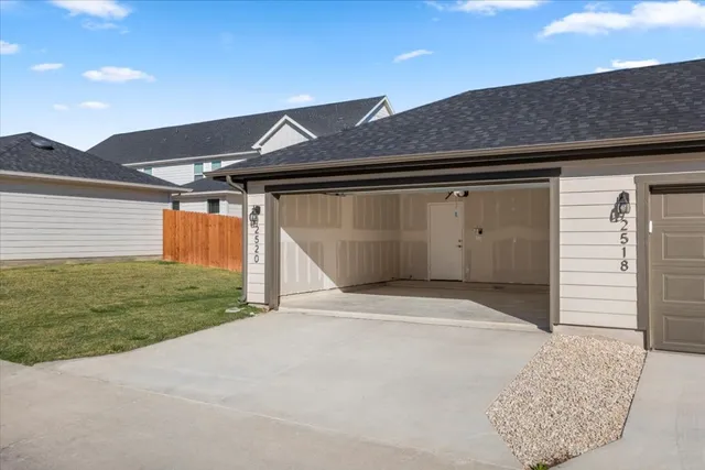 a front view of a house with a garage