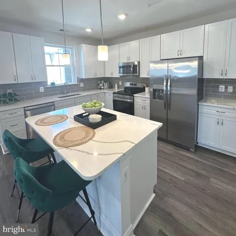 a view of a dining room with furniture and window
