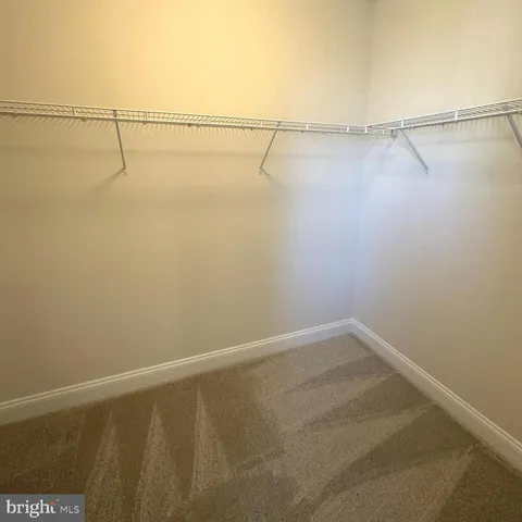 a bathroom with a double vanity sink toilet mirror and shower