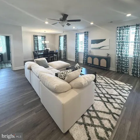 a bathroom with double vanity and a mirror