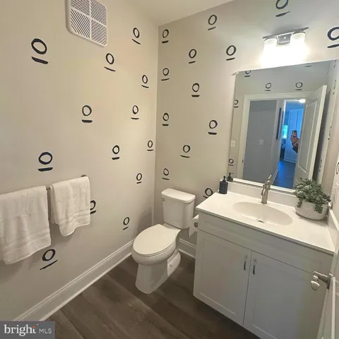 a bathroom with a wooden floor