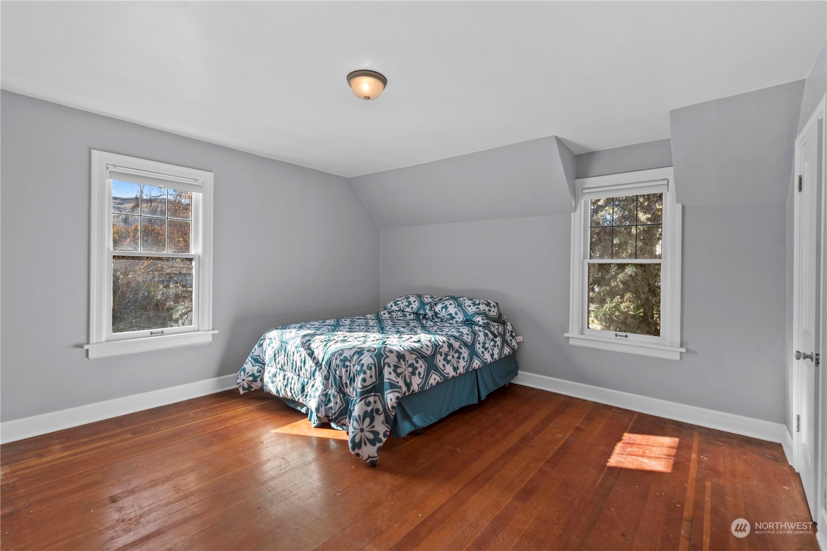 618 Hawthorne Street Wenatchee, WA 98801 - Photo 18 of 37 a bed sitting in a bedroom next to a window