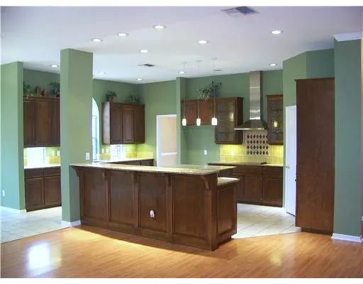a large bathroom with a large mirror vanity and shower