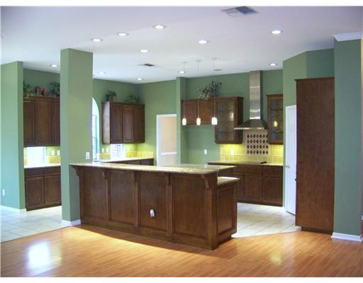 7725 Valley View Drive Corpus Christi, TX 78413 - Photo 2 of 9 a large bathroom with a large mirror vanity and shower