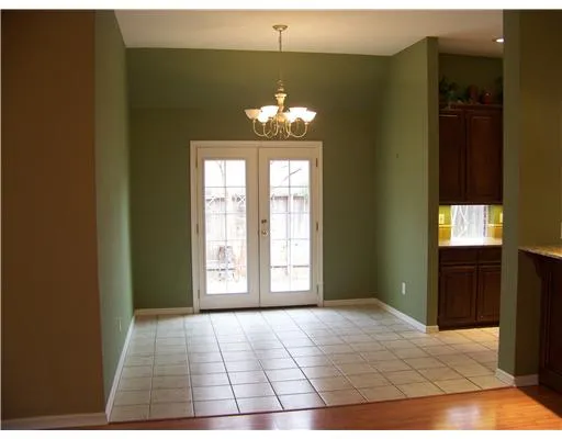 a view of an entryway with a chandelier