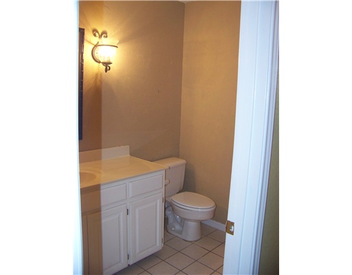 7725 Valley View Drive Corpus Christi, TX 78413 - Photo 6 of 9 a bathroom with a granite countertop toilet and sink